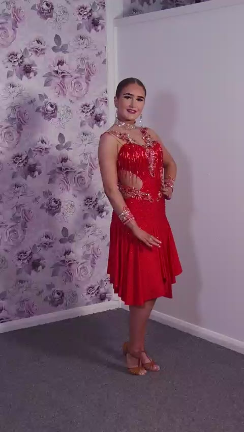 206 Red Lycra Dress with super full skirts. Motif detailing to back. Decorated with Siam bead droppers, cut out sides decorated in Siam & AB stones