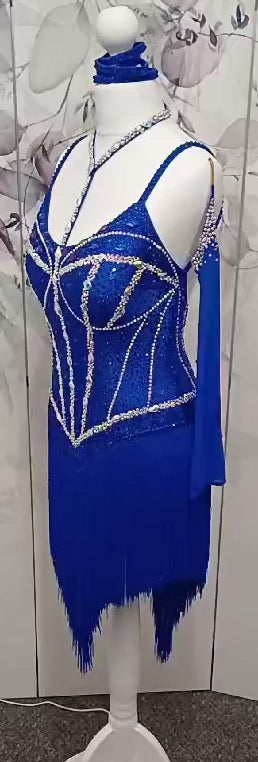 014 Royal blue Competition Latin Dance Dress. Heavily stoned in AB & Sapphire. Full fringed skirt for maximum movement. Neck detailing. Comes with long stoned gloves & Bracelets