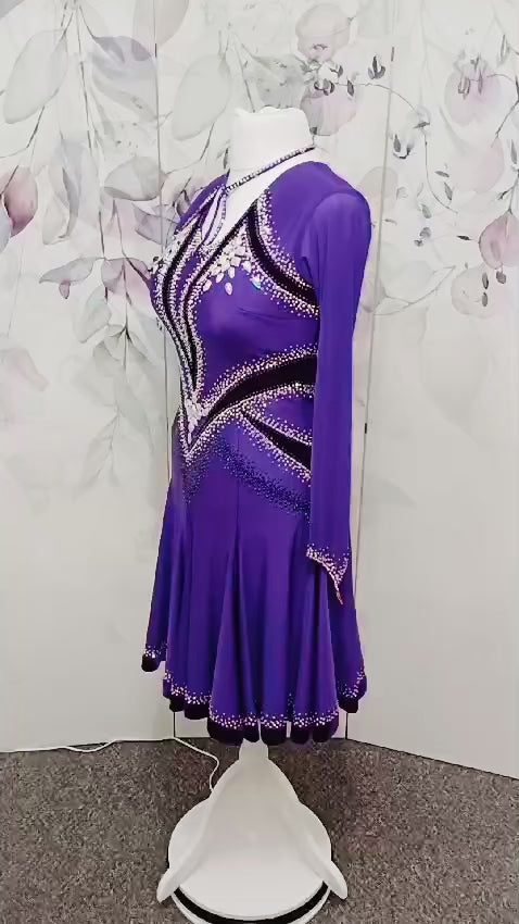 041 Cadbury Purple Competition Latin Dance Dress. Deep purple contrast pattern heavily stoned in AB & Amethyst AB. Bold & Flattering design. Full skirt giving maximum movement.