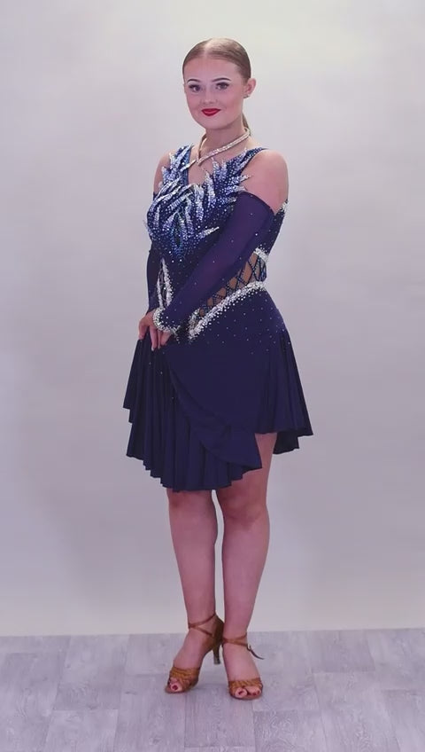 12L Navy Blue Competition Latin/Rhythm Dress. 3D Design to upper chest with flattering detailing to Hips. High back giving option to wear own Bra. Stoned in Blue, Blue AB & AB
