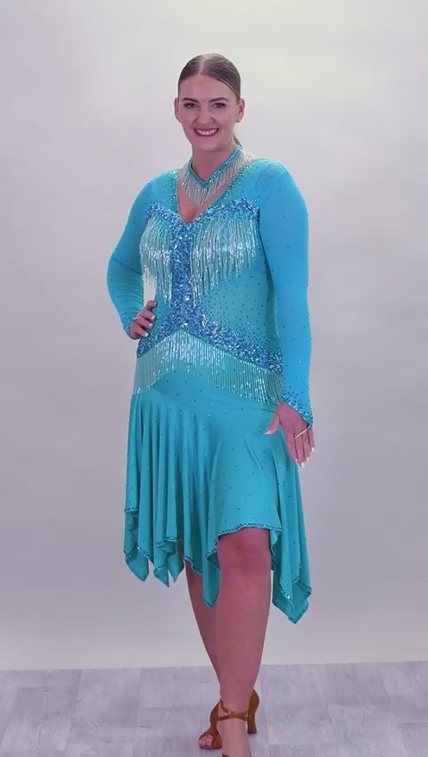 0101 Latin Dance Dress. Very full skirts giving maximum movement. Beading to the chest & waist area. Bodice back & front mesh with flesh under to allow the option to wear own Bra. Stunning stoning detail.
