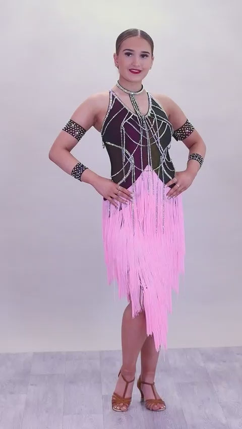087 Black & Pink layered Fringe Latin Dress. Rainbow metallic bodice with stoned materials drapes & droppers. Backless dress with material droppers.