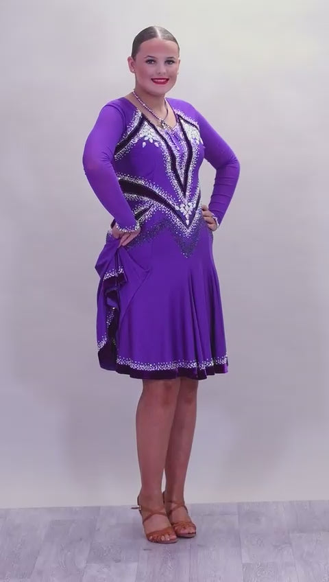 041 Cadbury Purple Competition Latin Dance Dress. Deep purple contrast pattern heavily stoned in AB & Amethyst AB. Bold & Flattering design. Full skirt giving maximum movement.