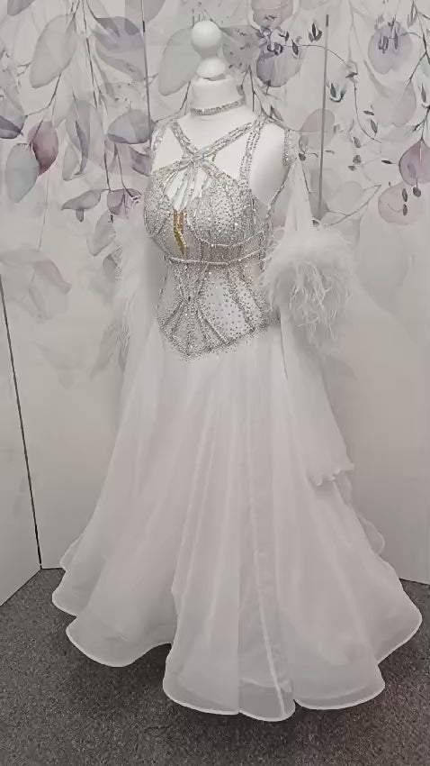 013 White Competition Ballroom/Sequence Dance Dress. Striking detailing to both the front & Back. Stoned in AB and sunshine. Cones with gloves, floats & Ostrich Boa cuffs.