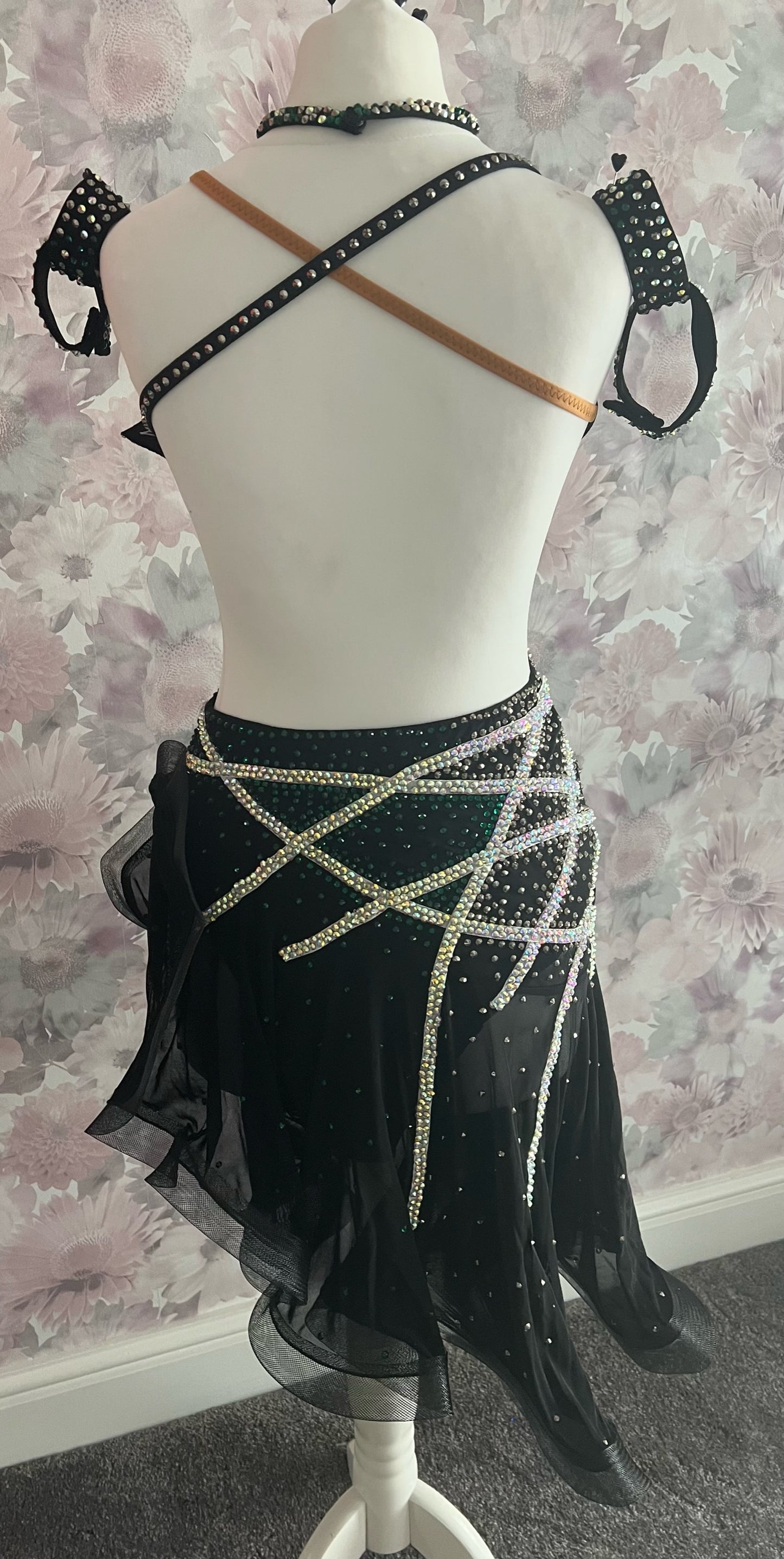 097 Black Heavily Stoned Gem Latin Dress. 3D design to the chest. Backless dress with crinoline edged skirt. Stoned in AB